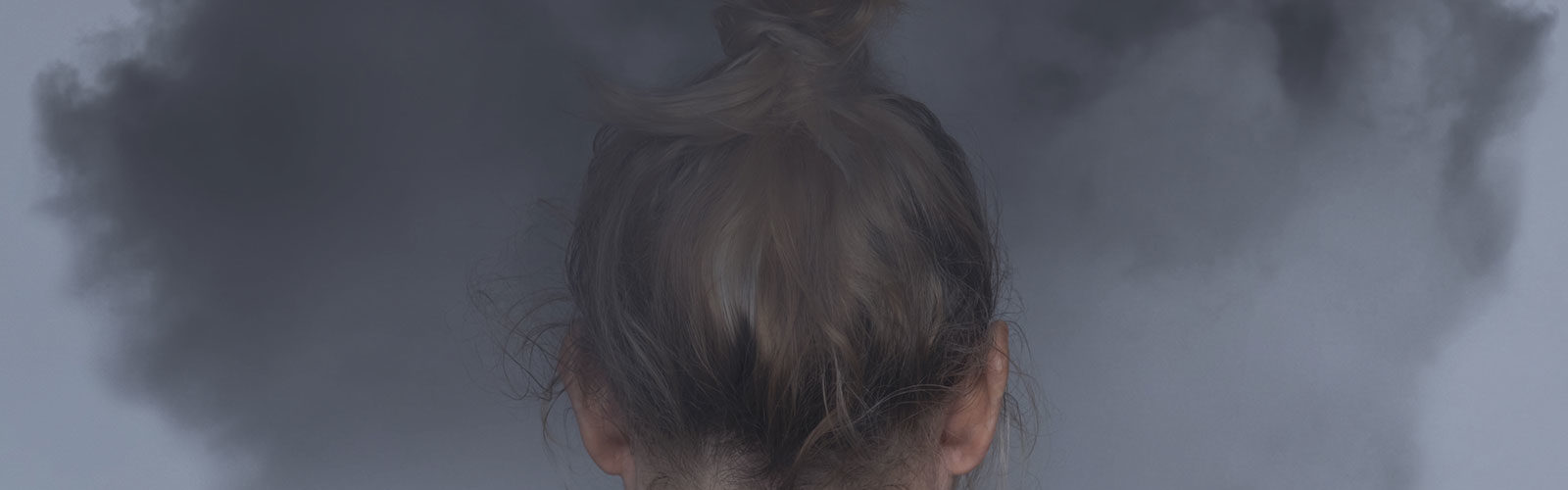 girl with dark storm cloud - mental health - 337540393_web.jpg