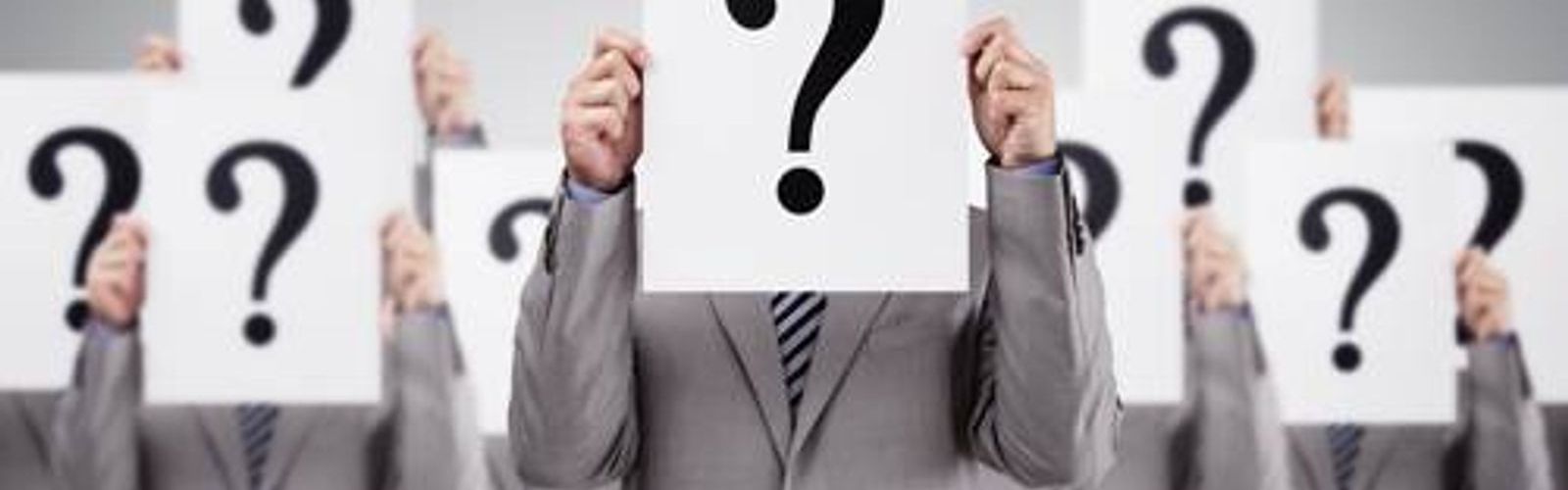 men in suits holding question marks_297295946_web_small_NOL.jpg