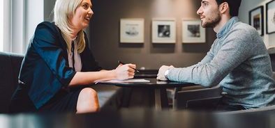 payroll officer having meeting with client bs470858965_web.jpg