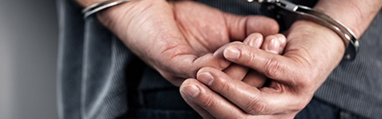 hands with handcuffs - breaking law - tax evasion - fraud (bigstock 85128803)_web_small_NOL.jpg