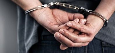 hands with handcuffs - breaking law - tax evasion - fraud (bigstock 85128803)_web_small_NOL.jpg