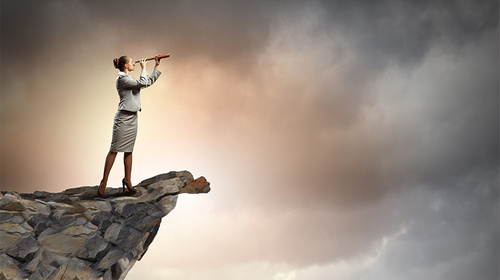 woman on cliff looking into the future of payroll (bs42691009)_web.jpg
