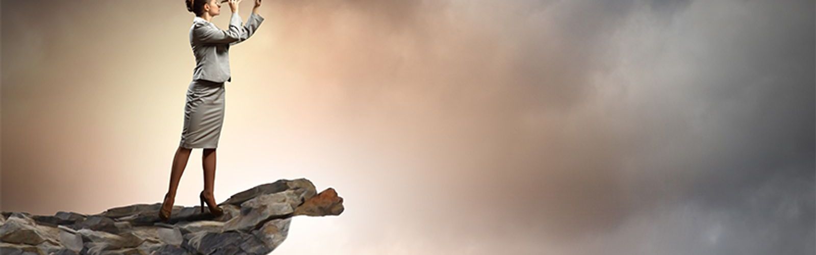 woman on cliff looking into the future of payroll (bs42691009)_web.jpg