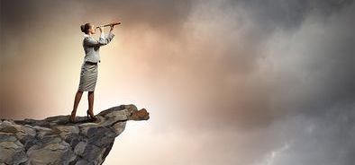 woman on cliff looking into the future of payroll (bs42691009)_web.jpg