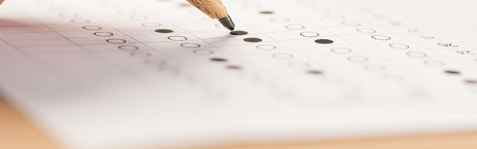 hand and blue pencil taking test_RPL_456539589_web.jpg