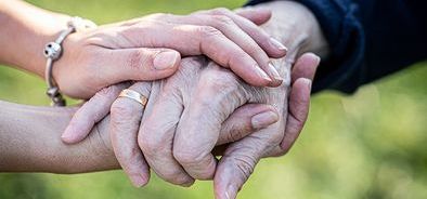 Caregiver-carer-hand-holding--358178528.jpg