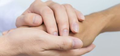holding hands - comfortaing- bereavement (bs238388866).jpg