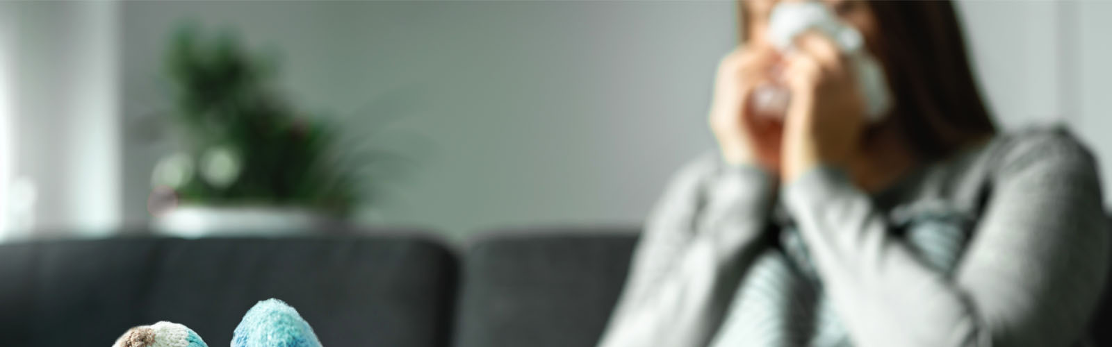 woman sneezing at home sick - sick pay - ssp (bs280644544)_web_banner.jpg