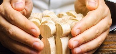 hands surrounding people - job retnetion scheme - protect employees (bs319703584).jpg