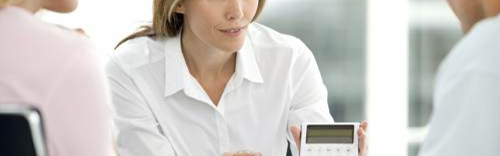 woman pointing at calculator_288432512_web_small_NOL.jpg
