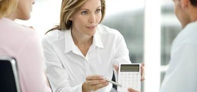 woman pointing at calculator_288432512_web_small_NOL.jpg