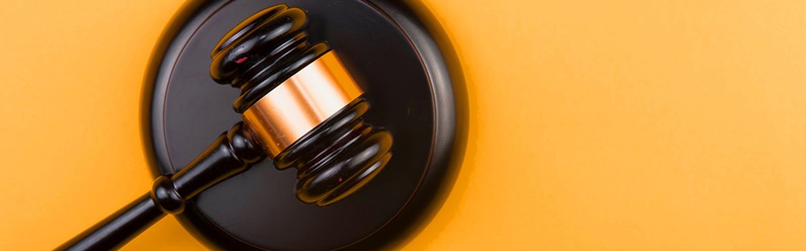 Judge-Gavel-On-Light-Backgroun(BS429227342).jpg