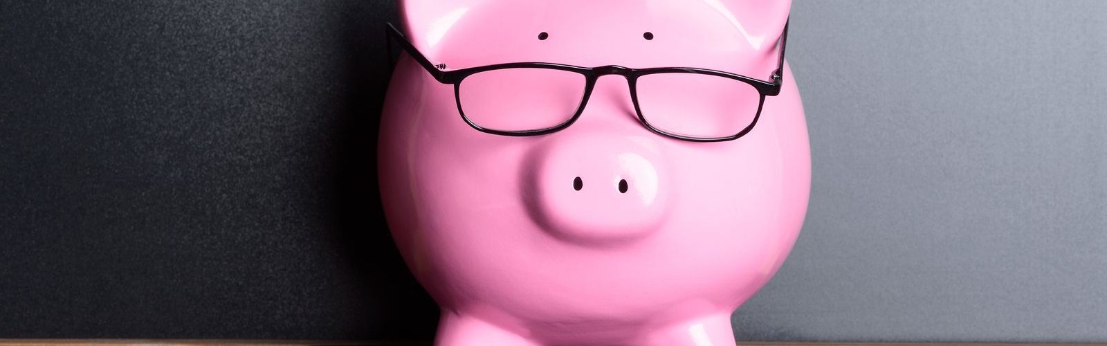 bigstock-Piggy-Bank-With-Eye-Glasses-On-80307374.jpg