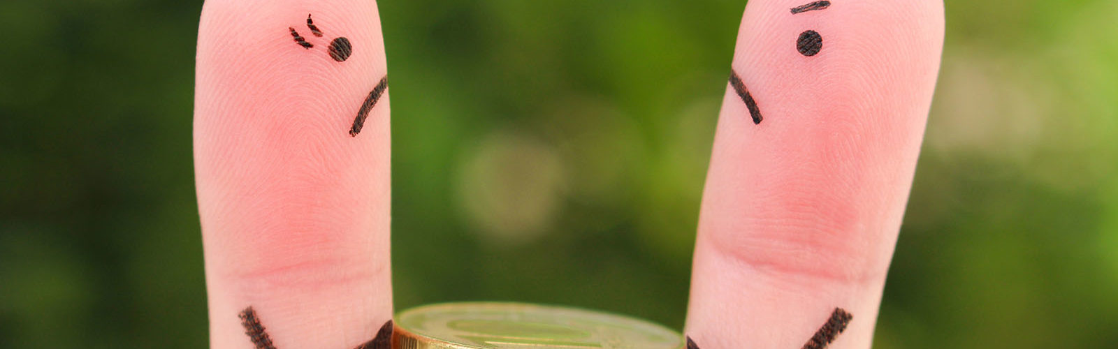 two fingers holding pound coin - divorce - pensions - web.jpg
