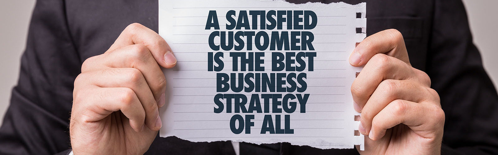 man holding client and customer services sign - 171477011_web.jpg