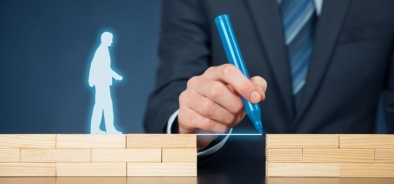 mans hand drawing a bridge between blocks - help-guidance (bigstock 127131332)_web.jpg