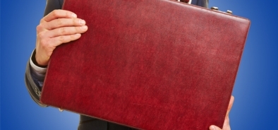 man holding red briefcase - budget - blue background (bs 109455590)_web.jpg