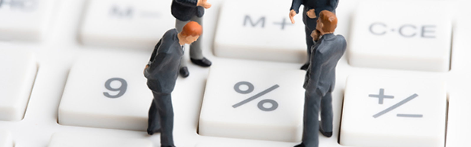 Business-Mans-Standing-On-Calc (bs313149565)_.jpg