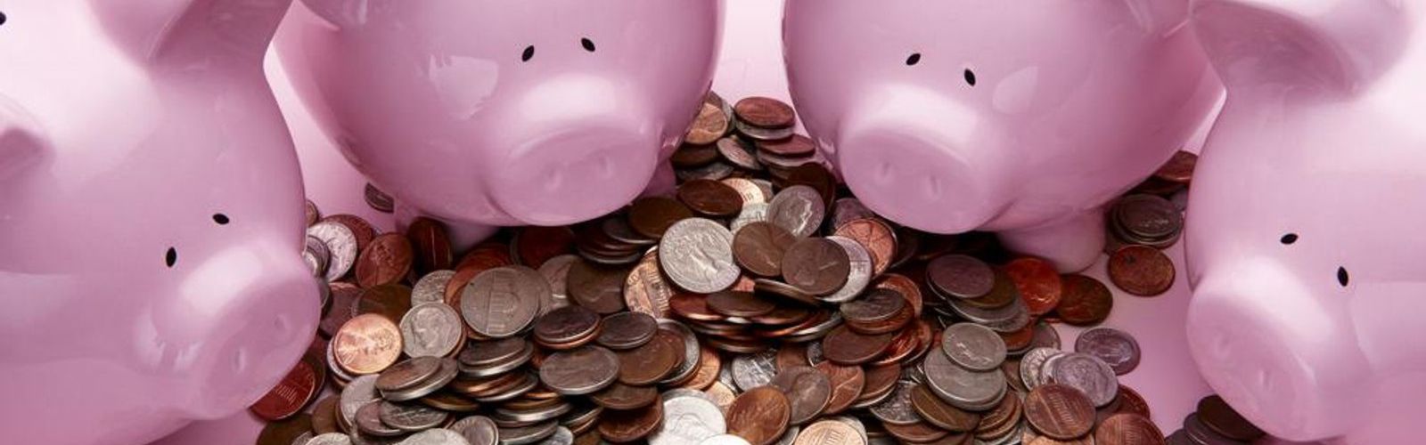 piggy banks surrounding money_69261058_web.jpg