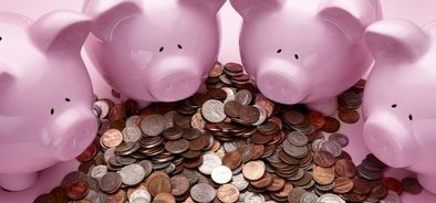 piggy banks surrounding money_69261058_web.jpg